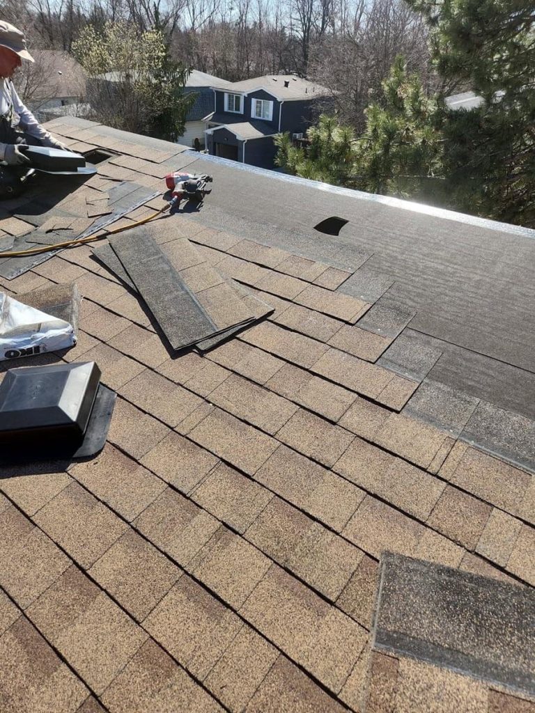 JNG Services installing brown asphalt shingles on residential roof in toronto