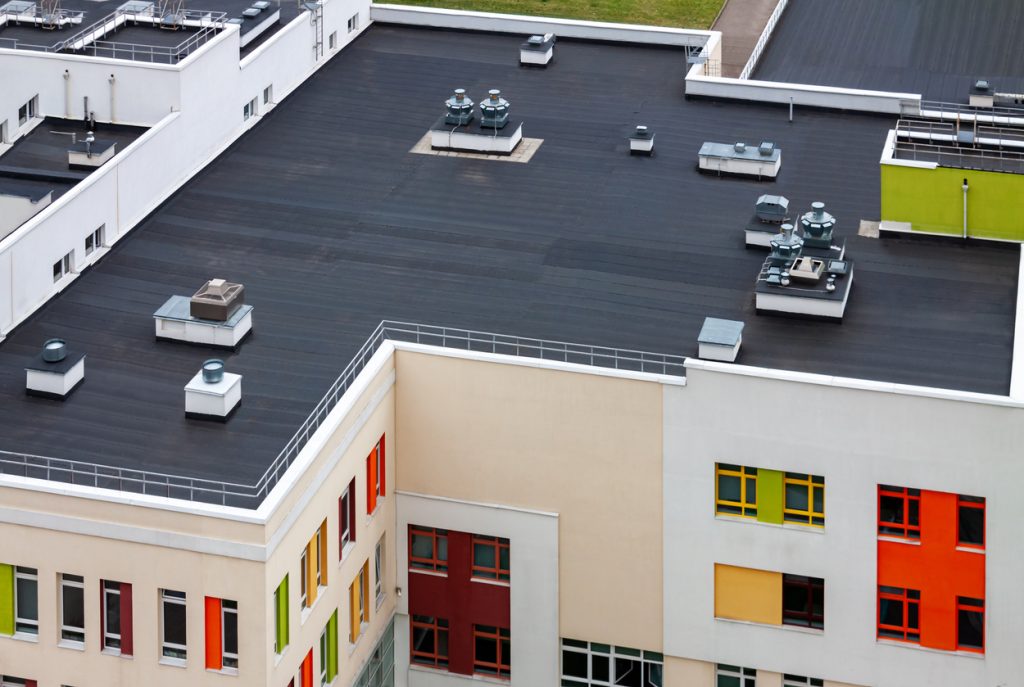 jng services flat commercial roofing costs in toronto on a colourful building