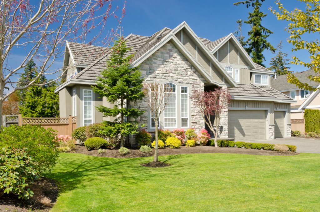 luxury home with a shingle roof for jng services toronto residential roof summer maintenance