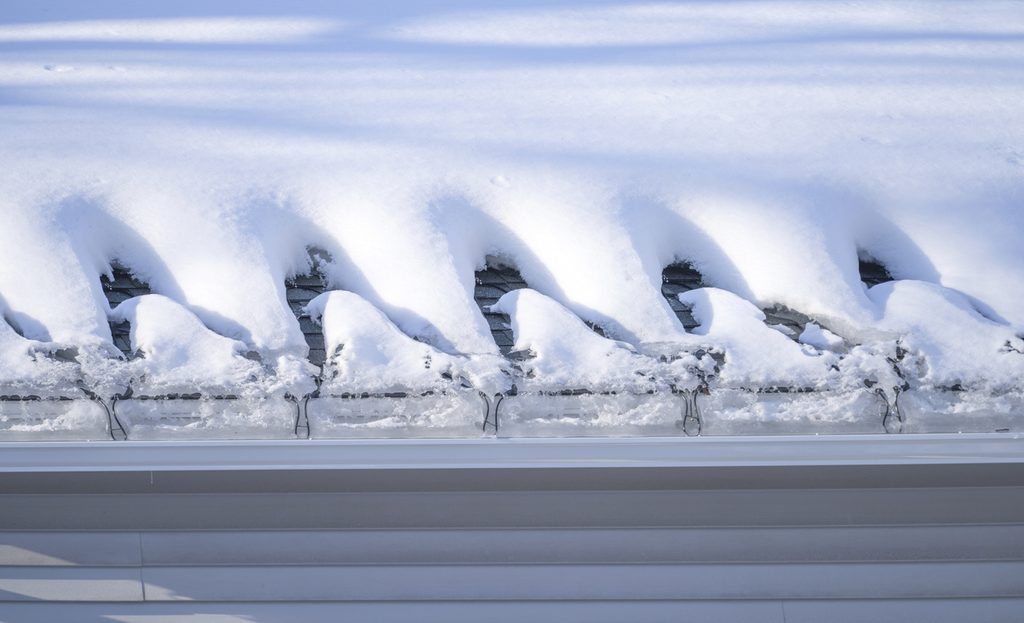jng services rooftop with heating cable installed after snow storm to prevent ice dams