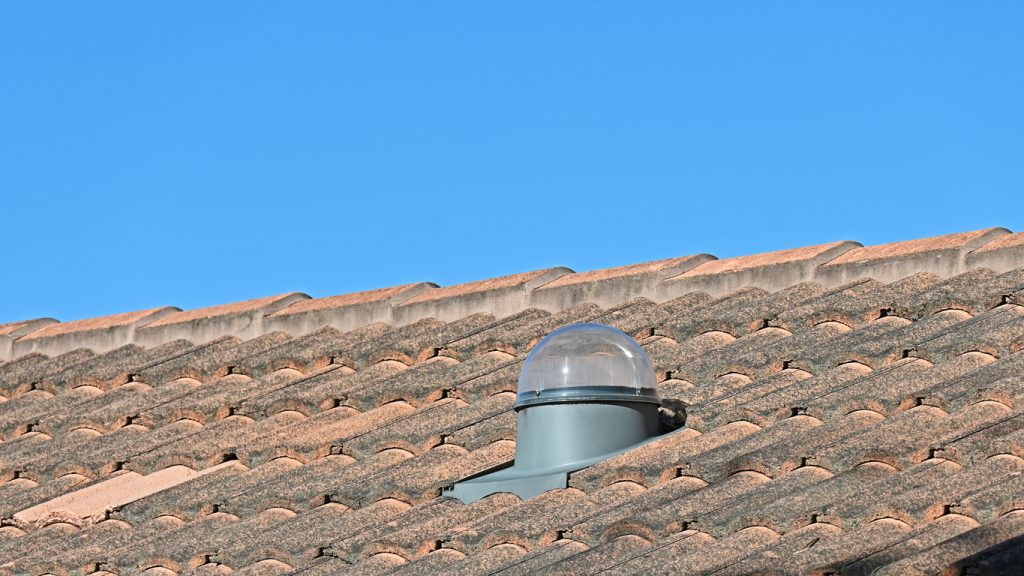 JNG Services tubular or sun tunnel skylight on a tiled house roof